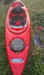 Pelican Red Kayak With Paddle And Black Seat. Fixed Price $280.00.